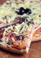 Pizza on wooden background