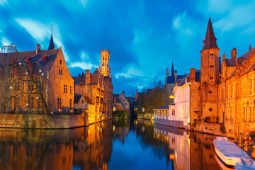 Fototapeta na wymiar Cityscape with a tower Belfort from Rozenhoedkaai in Bruges at s