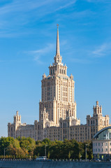 Fototapeta na wymiar House with a spire Soviet times on Moskva River embankment