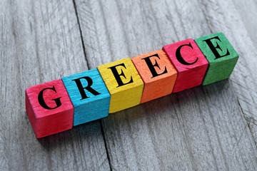 word greece on colorful wooden cubes