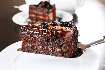 Yummy chocolate cake served on table, close-up