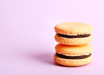 Gentle colorful macaroons on color background