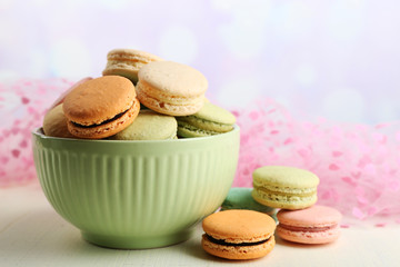 Assortment of gentle colorful macaroons in colorful bowl