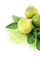 Fresh lime with sea crystals isolated on white