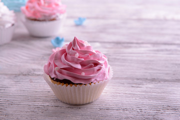 Delicious cupcakes on table close-up