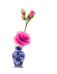 pink nylon fabric flower in blue ceramic vase