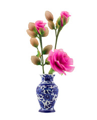 pink nylon fabric flower in blue ceramic vase