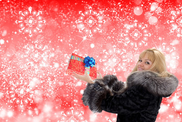 Woman with holidays gift in New Year