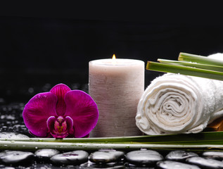 Fototapeta na wymiar spa concept –red orchid and candle with towel