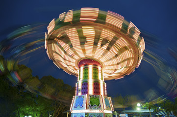 colorful carousel in motion © leeyiutung