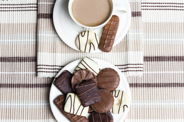 cup of coffee with chocolate biscuits