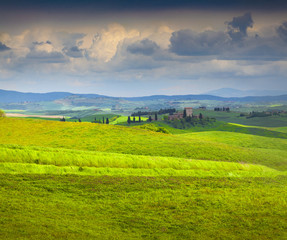 Fototapeta na wymiar Cloudy morning on countryside in Tuscany, Italy.