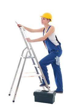 young woman electrician in workwear with toolbox, screwdriver an