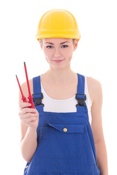 young beautiful woman builder in blue coveralls with screwdriver