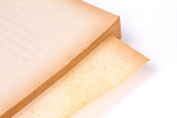 page conner of old paper and book , selective focus