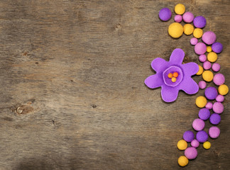 purple flower and beads from felt and place for text