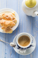 coffee cup black wooden board brown white jug milk croissants