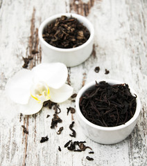 Black  and green tea with orchid flower