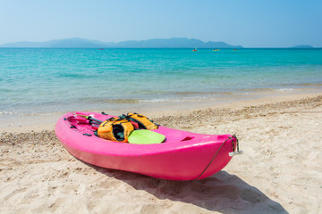 Colorful kayak on tropical beach