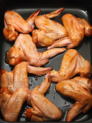 Chicken wings with sauce for baking.