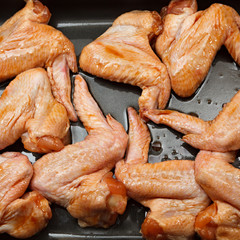 Chicken wings with sauce for baking.