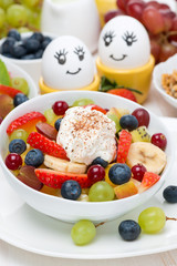 fruit salad with whipped cream and painted eggs for breakfast