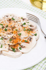 salad of fresh mushrooms with red pepper, olive oil and parsley