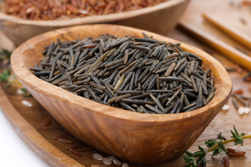 wild rice in a wooden bowl, close-up