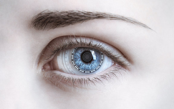 Close-up of woman's eye. New technologies concept
