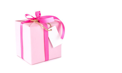Pink gift box with blank tag on white