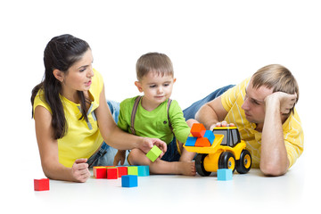 kid with his parents play building blocks