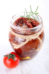 Sun dried tomatoes with olive oil in a jar