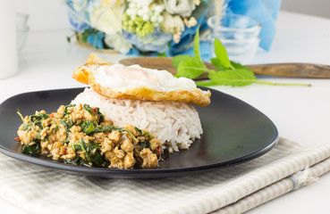 Dish of rice - egg and stir fried chiicken with basil