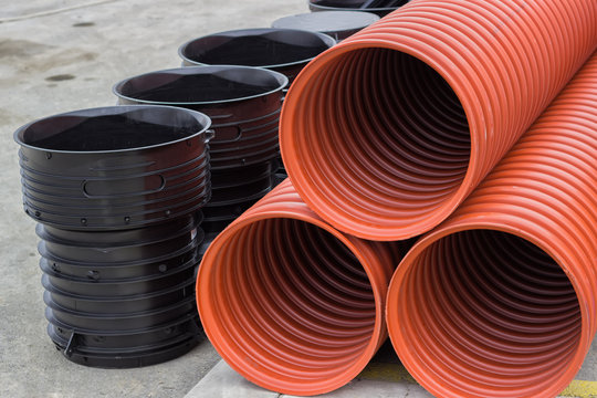 Close up of stack of underground plastic pipes
