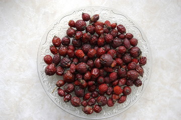 Heap of dried rose hips in a dish