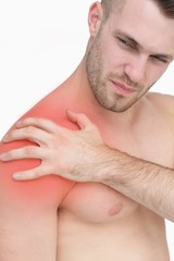 Obraz premium Closeup of shirtless man with shoulder pain