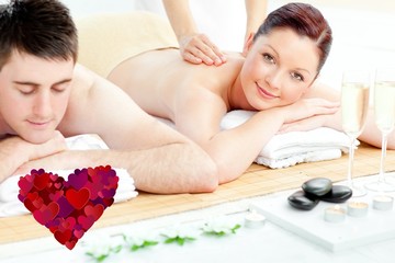 Obraz na płótnie Canvas Composite image of attractive couple receiving a back massage