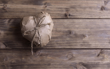 Heart wrapped in brown kraft paper
