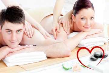 Obraz na płótnie Canvas Composite image of loving young couple enjoying a back massage