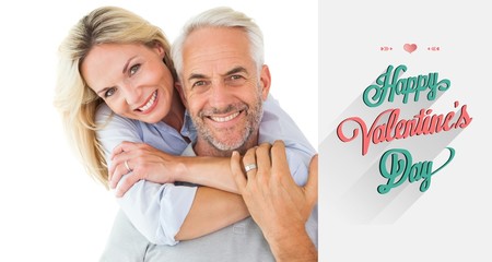 Composite image of happy couple standing and hugging