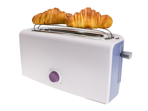 Toaster prepares croissants. Isolated on white background.