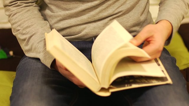 Flipping reading and leafing through a book