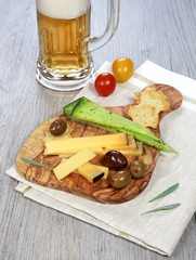 Olives provencal, solid cheeses and a glass of unfiltered beer