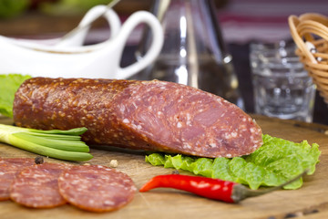 sausage on a wooden plate in a restaurant