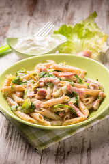 pasta with bacon lettuce and cream sauce, selective focus