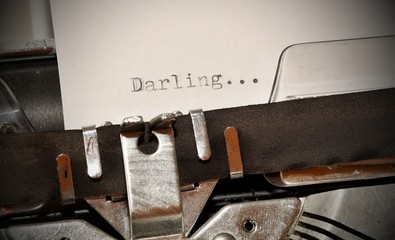 Darling word typed on old black typwriter