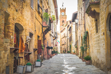 Street in old mediaeval town in Tuscany, Pienza. - obrazy, fototapety, plakaty