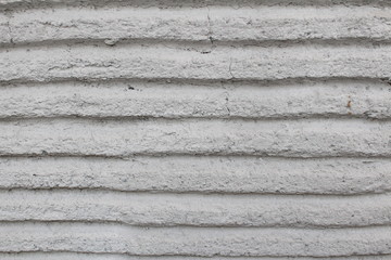 Horizontally striped plastered wall