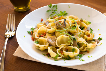 Gnocchi with mushrooms and dried tomatoes, italian cusine