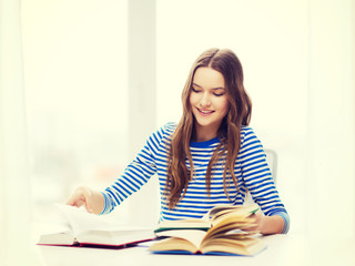 happy smiling student girl with books